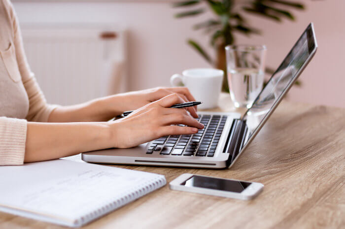 woman-typing-on-laptop