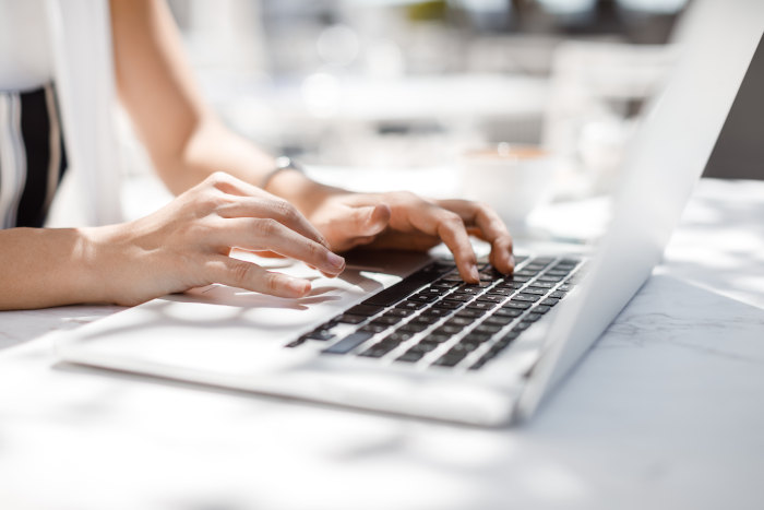 woman-hands-on-laptop